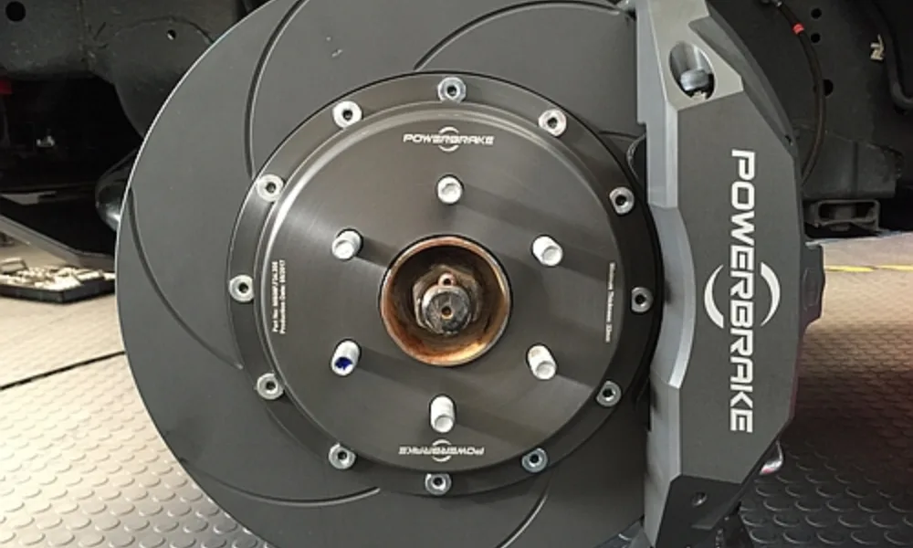 High-performance brake pads designed by Powerbrake for Dakar Rally vehicles, displayed in a precision layout.